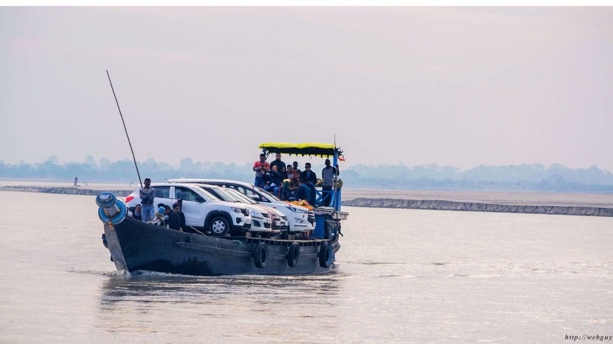 A ferry taking people and car across the Brahmaputra river towards Majuli Island